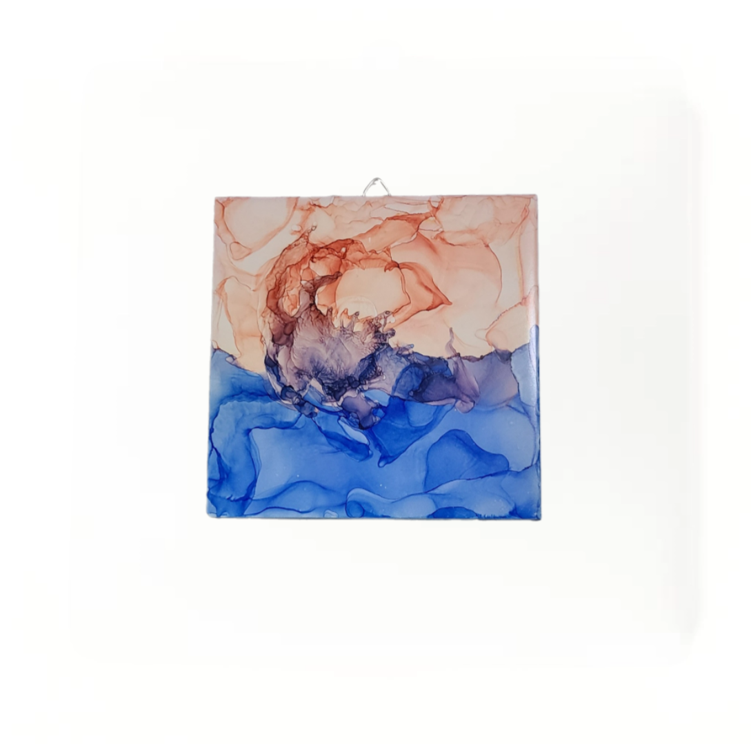 Abstract art on 6 x 6-inch ceramic tile with a mix of blue and  pink colors.