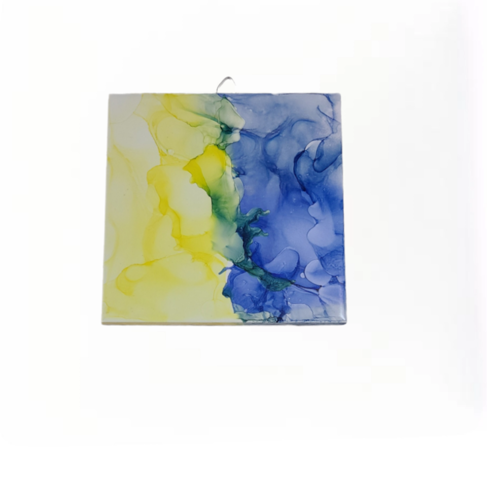 Yellow and Blue alcohol Ink on a 6 x6-inch ceramic tile that can be hung on the wall