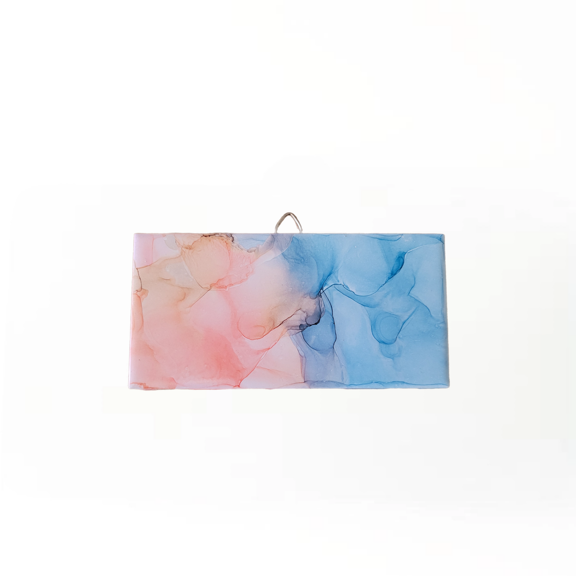 Abstract art on a 3 x 6-inch ceramic tile with a mix of blue and pink colors. 