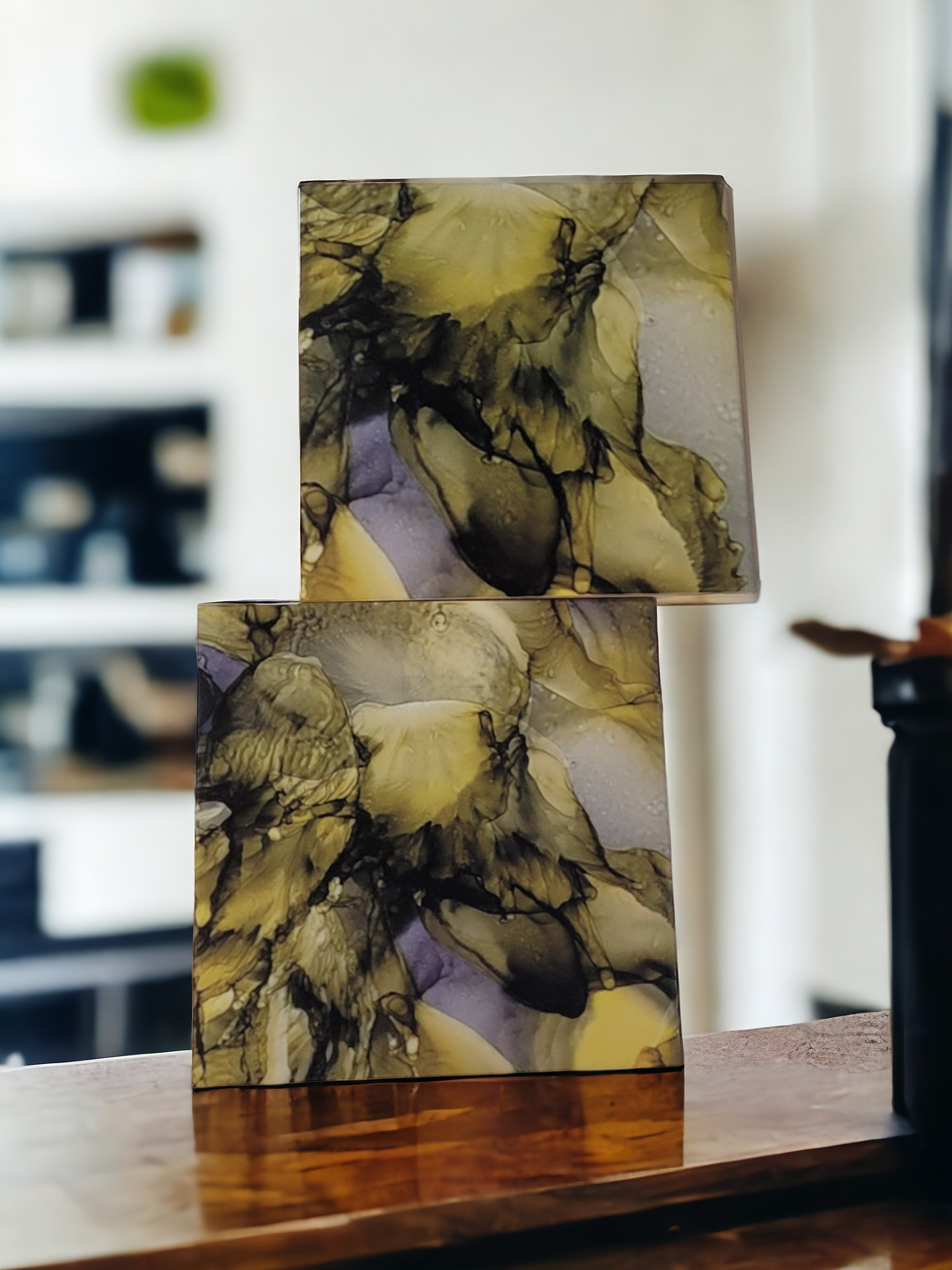 8x 8-inch ceramic tile alcohol ink art display that is an abstract design using a greenish-gold color and the sublimation process. 