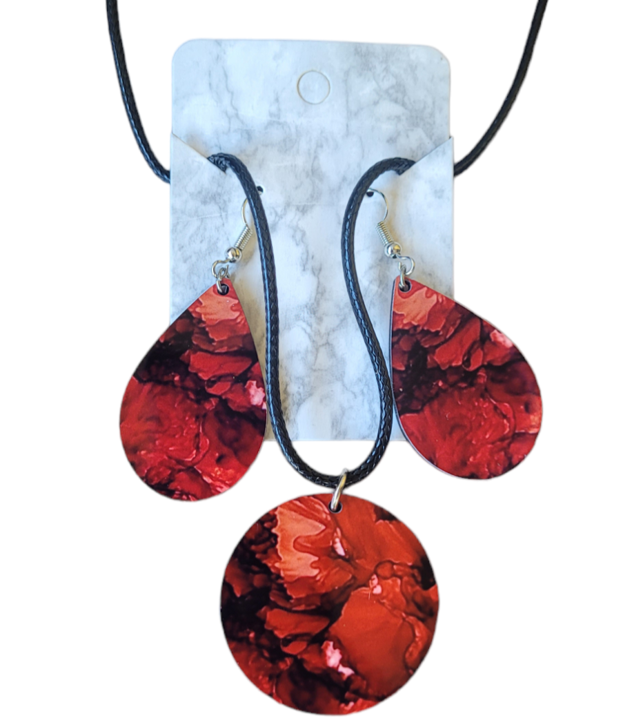 Deep red circle shaped necklace and teardrop earrings