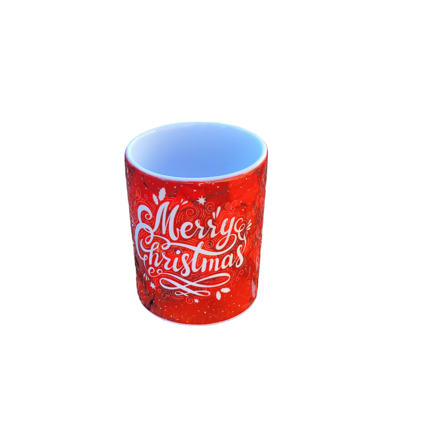 11 oz. mug with a red alcohol ink background with the words Merry Christmas in the color white