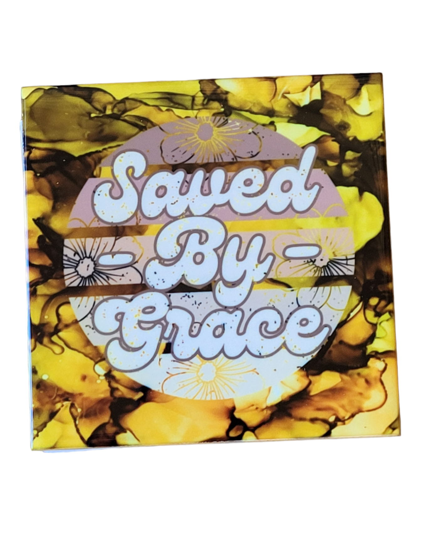 Nature colored alcohol ink background on 4.5 x 4.5-inch ceramic tile with the words "Saved By Grace" in a retro style font.