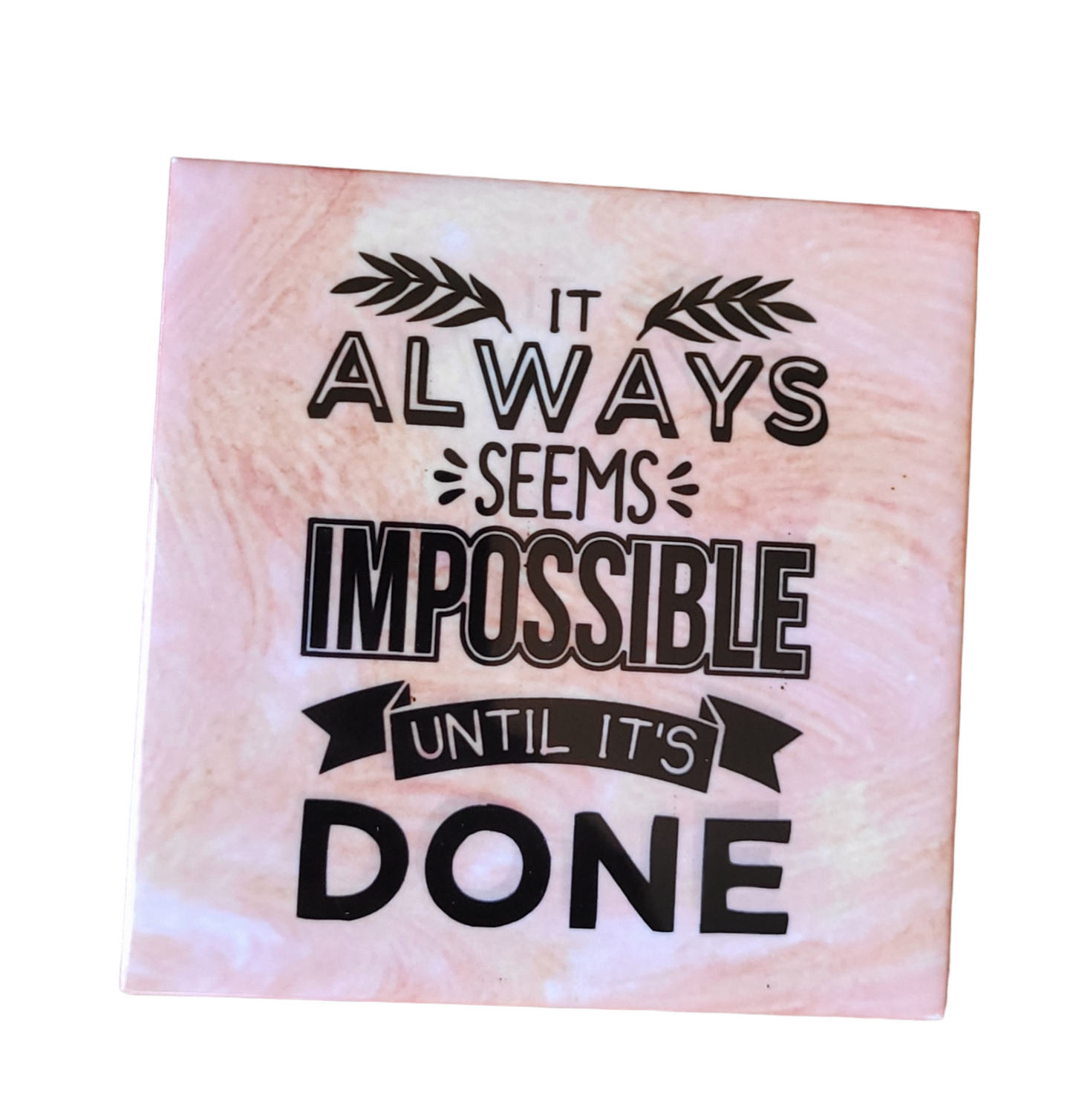 pink alcohol ink background on 4.5 x 4.5-inch ceramic tile with the words "It Always Seems Impossible until it's done"