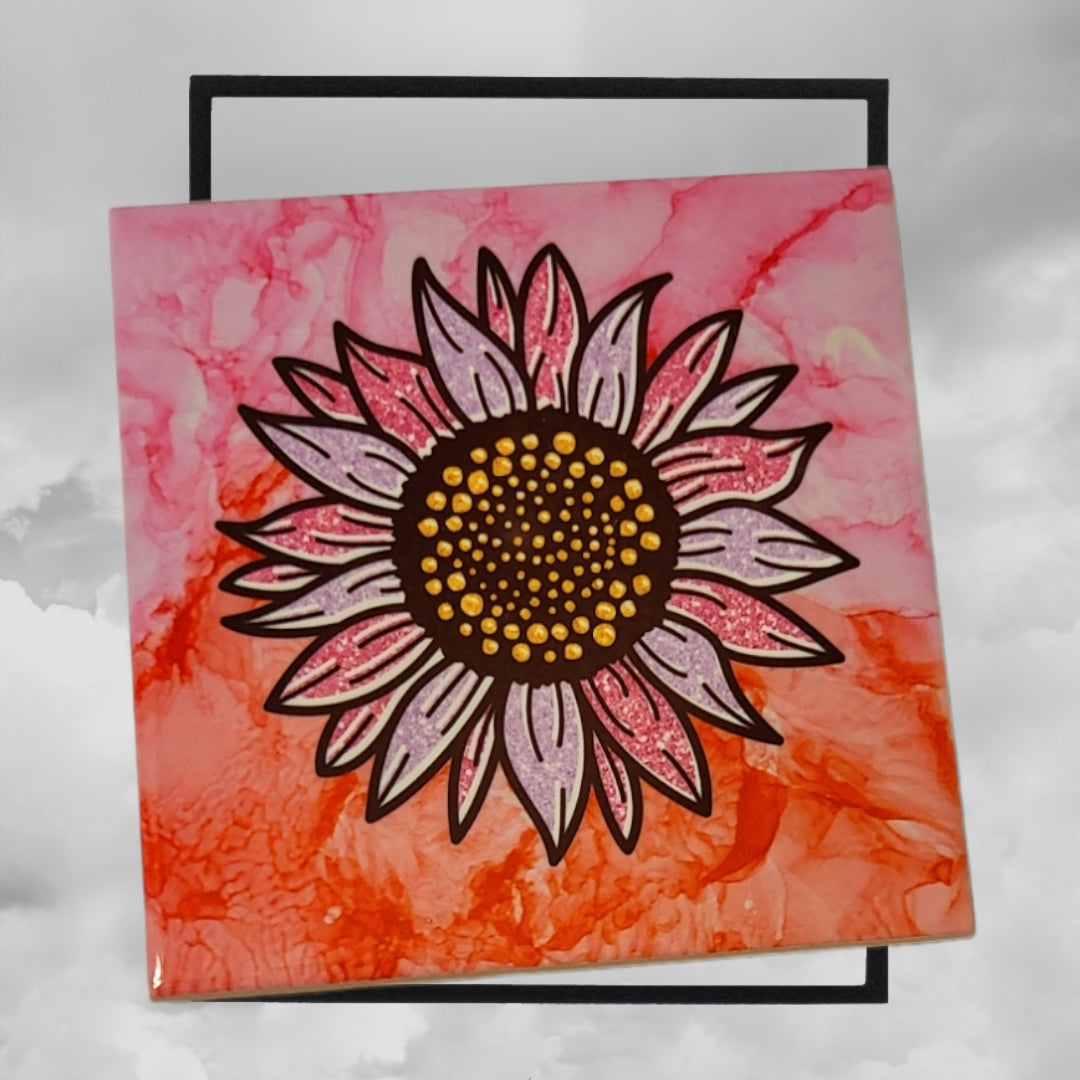 Two-toned pink colored alcohol ink background on 4.5 x 4.5-inch ceramic tile with a two-toned sunflower.